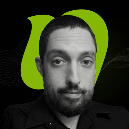 A black-and-white photo of a man with short dark hair and beard, wearing a black shirt, set against a green and black abstract background.
