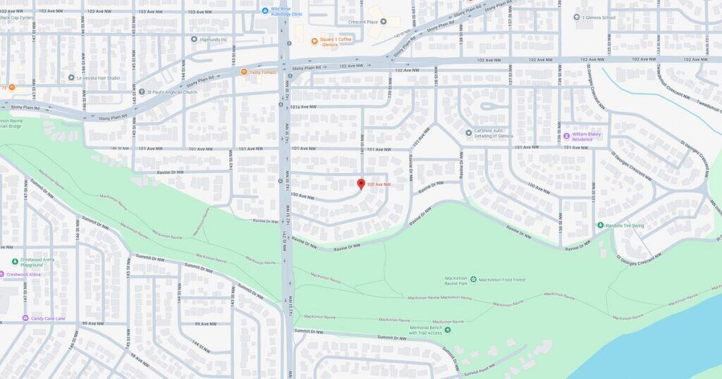 Detailed map showing a residential area adjacent to a green park and a water body, highlighting streets, pathways, and natural features.