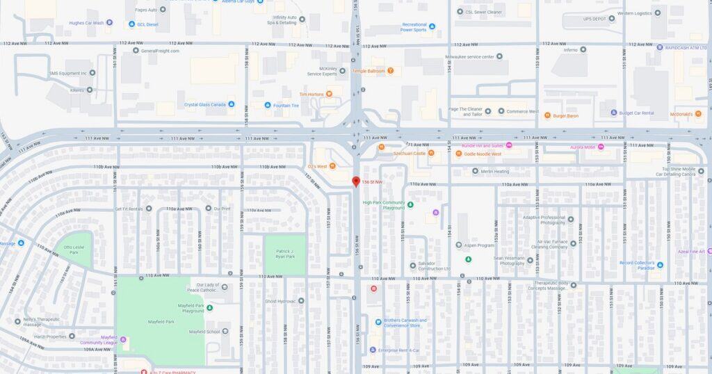 A detailed map of a city park showing pathways, green spaces, and surrounding streets during sunset.