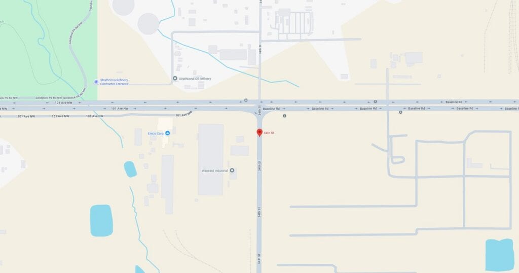 Map of a city intersection showing roads, nearby water bodies, and surrounding infrastructure.